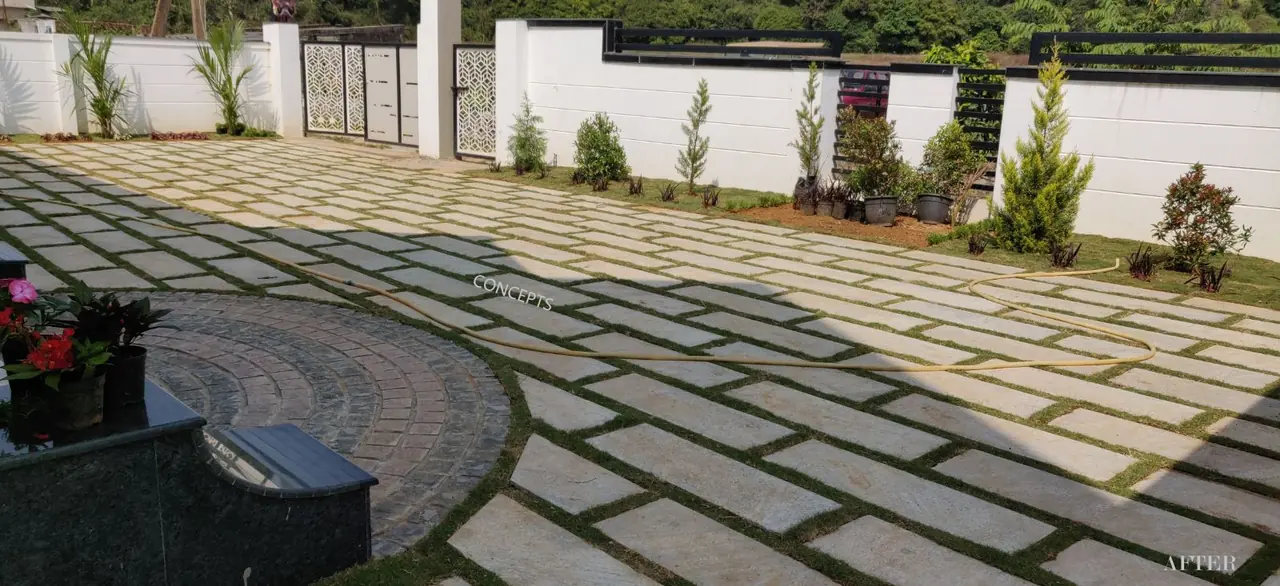 Grass-jointed stone paving with planted borders, Bittangala