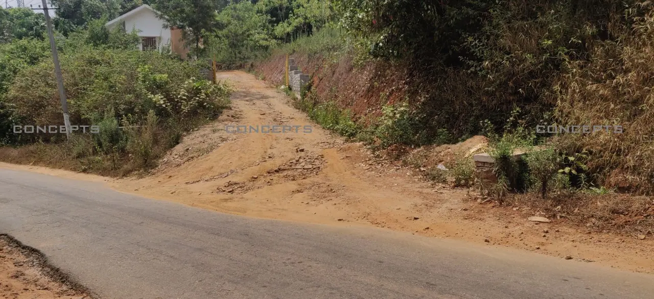Eroded mud access road before work